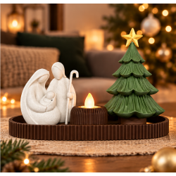 Cozy nativity scene with Christmas tree and candle.